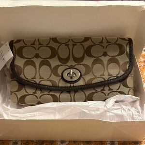 Coach Tan and Brown Signature Clutch. NEVER USED